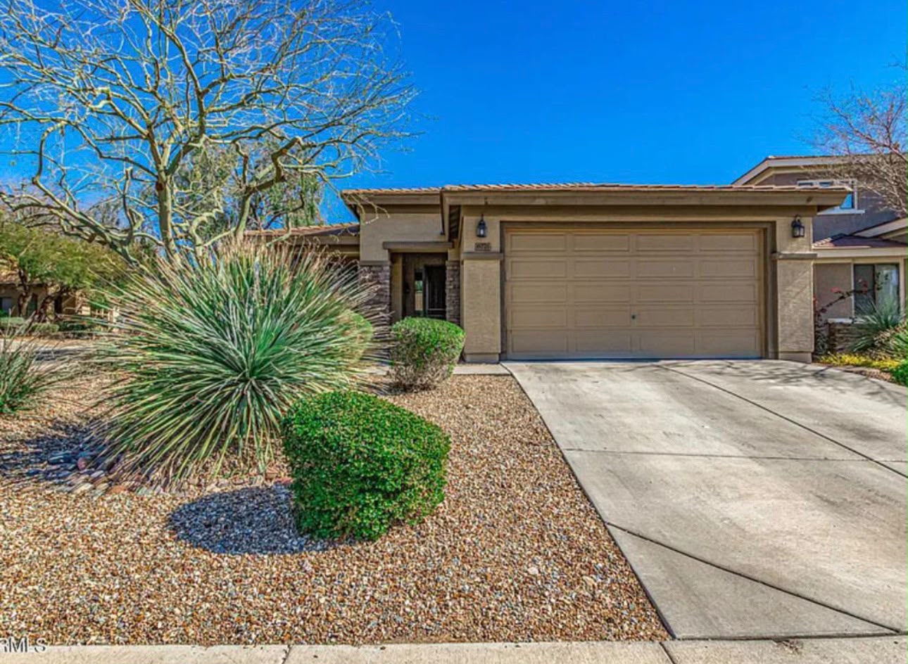 Front view of the home with 2-car garage